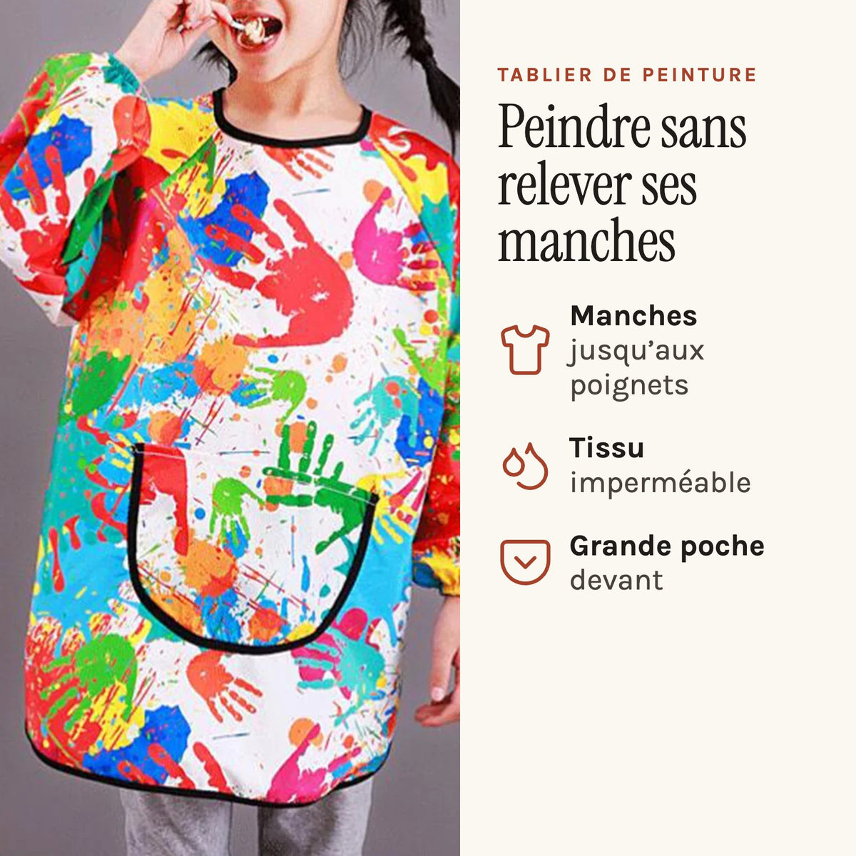 Tablier de peinture enfant à manches longues, motif mains, multicolore, porté par une enfant