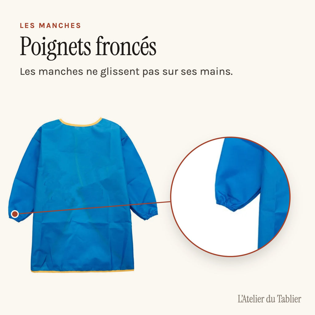 Blouse maternelle unie à manches longues, fermée par un scratch, poignet froncé